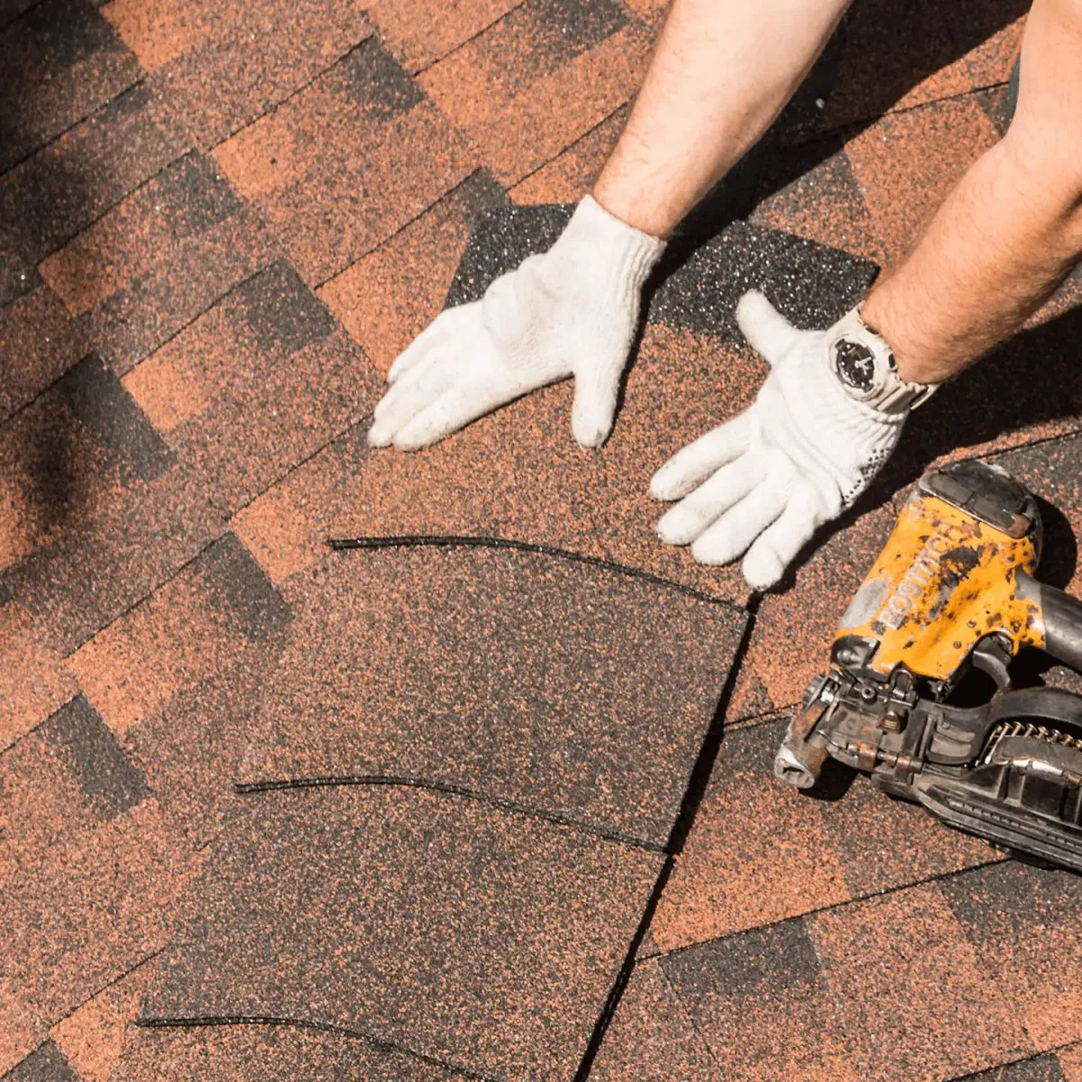 Roofer nailing replacement shingles